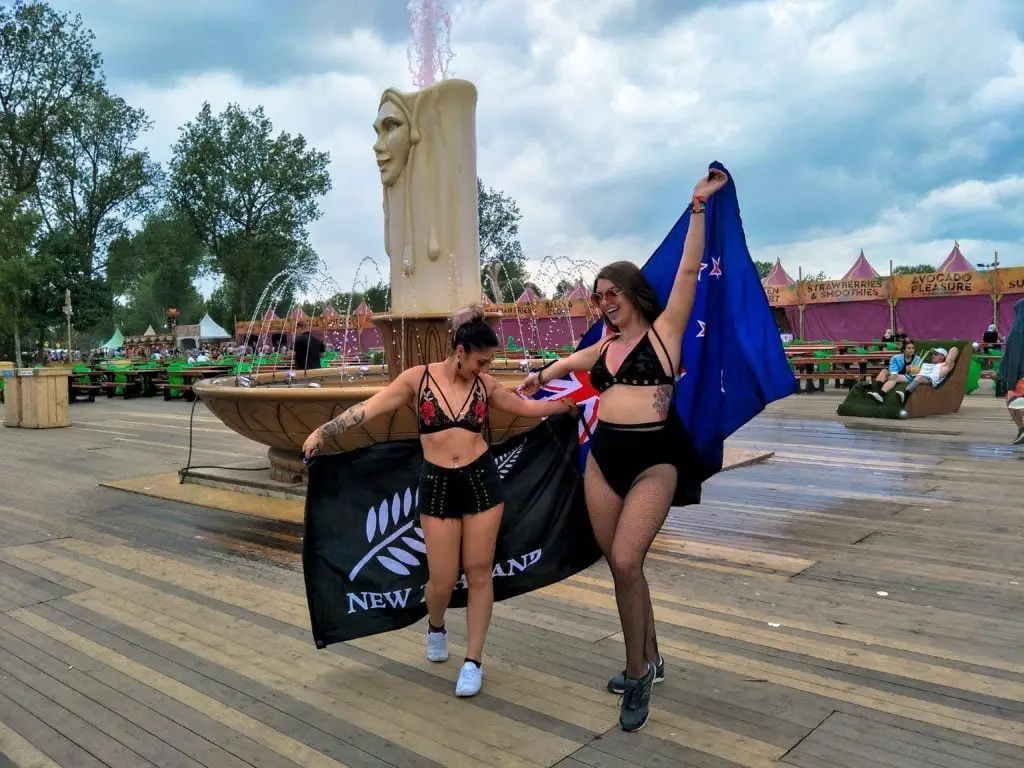 Tomorrowland Belgium - Female posing in front of the Dreamville candles
