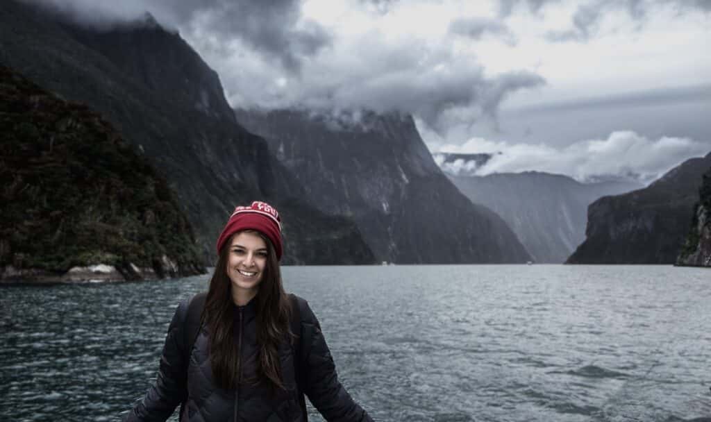 Cruising Milford Sounds - Picture of a female at Milford Sound infront of the lake