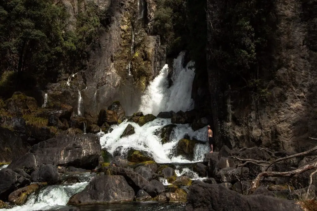 Things to do in Rotorua - Rotorua Itinerary: Standing below a waterfall