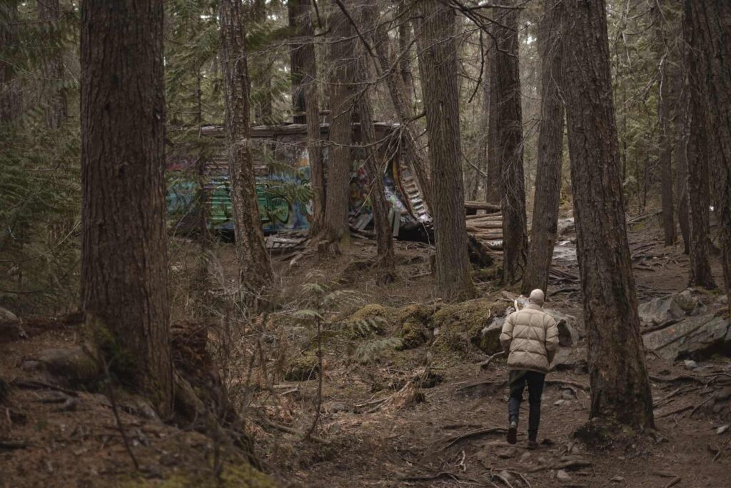 Walking through the forest in Whistler to an old train carriage.