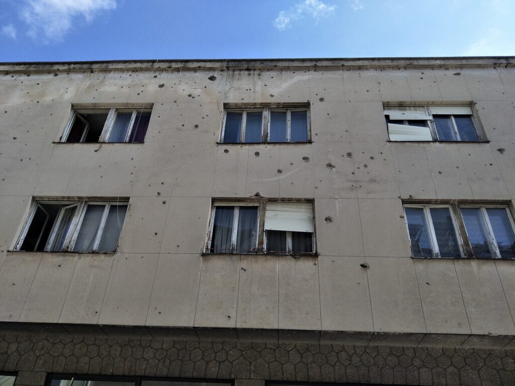 Bullet holes cover buildings in Sarajevo, damage left over from the Croat-Bosniak War in the early 1990's.