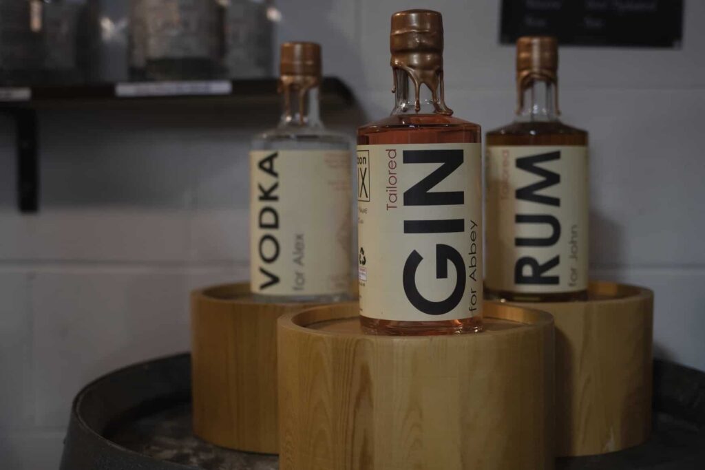 3 bottles of gin sitting on a table during gin tasting in Auckland