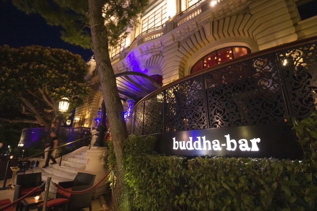 The Best Things to do in Monaco 3 Photo of Buddha Bar at night from outside the Monte Carlo Casino, one of the best things to do in Monaco.