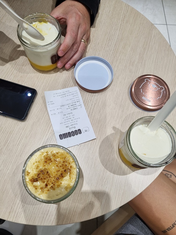 7 of The Best Indian Restaurants in Auckland 9 Image of 3 jars filled with a coconut dessert from Cocomo dessert restaurant in Auckland. One of the desserts is a creme brulee and the top of it has been crystalised with sugar.