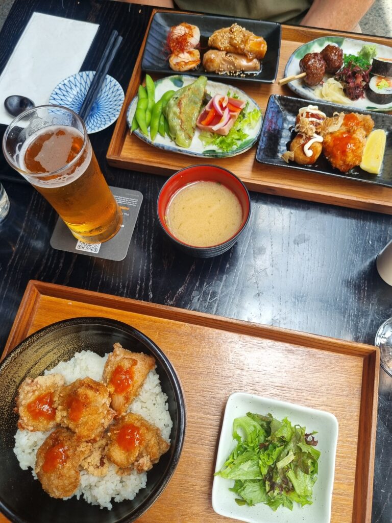 Best Japanese Restaurant in Auckland: Tokyo Bay Takapuna. This image shows two meals, a bento box and chicken karaage don buri